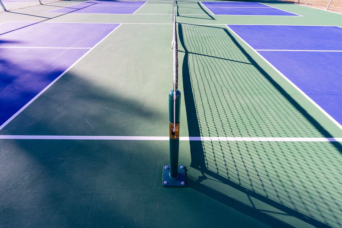 Pickleball court with net ready for play
