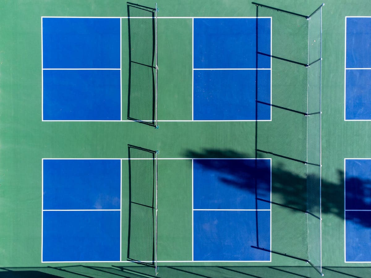 Aerial view of multiple pickleball courts at tournament facility